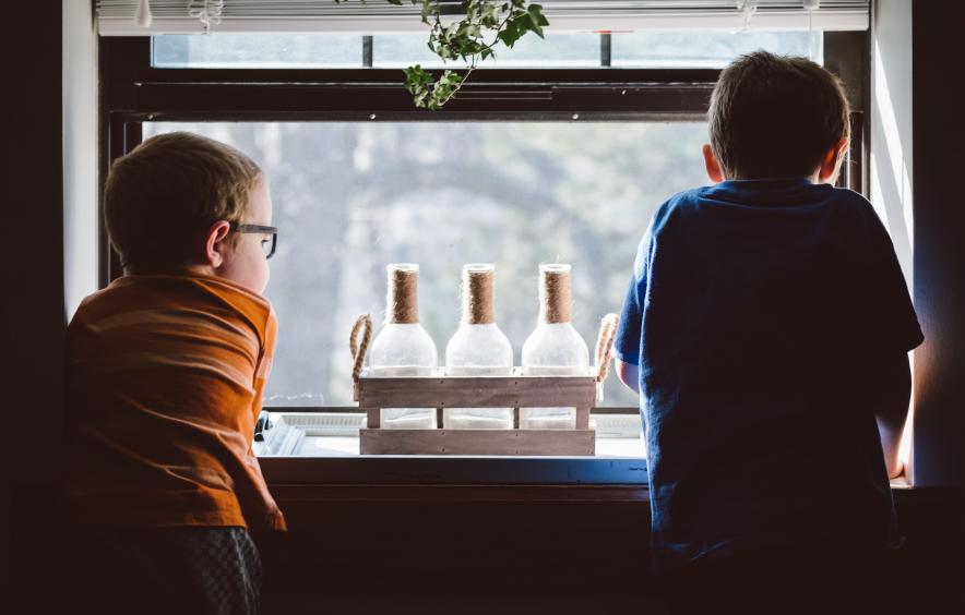 boys looking out window