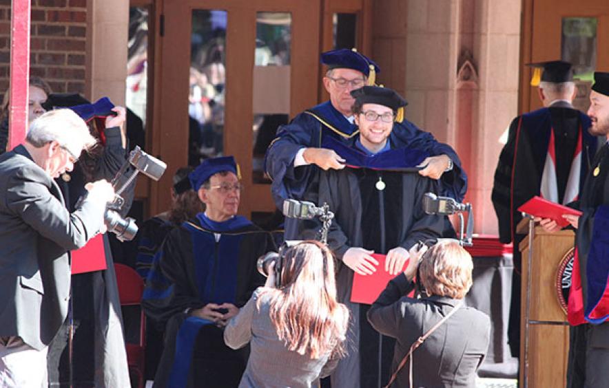 Student walking at graduation