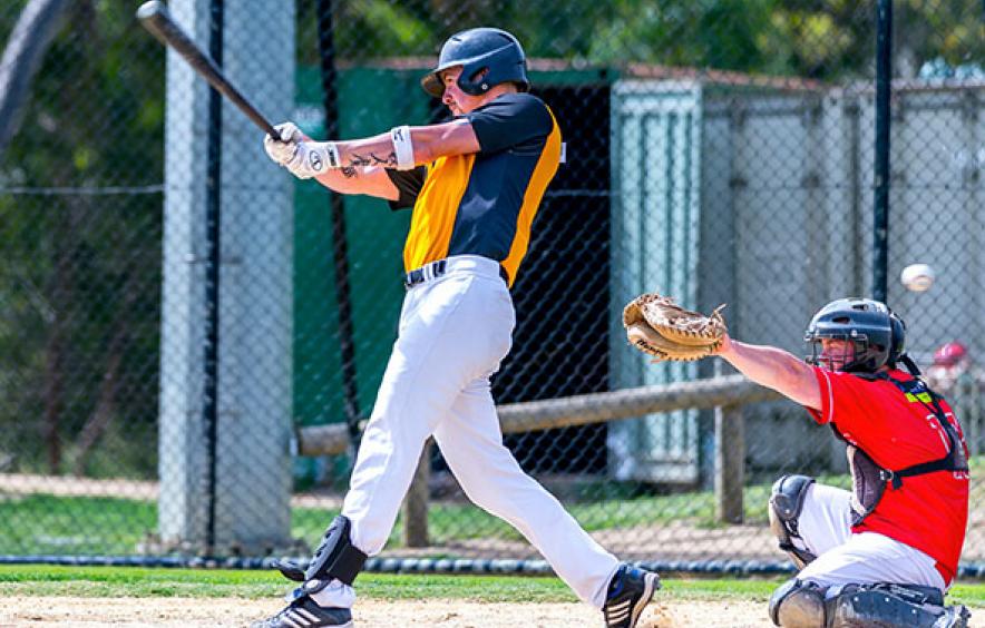 Baseball player swinging bat