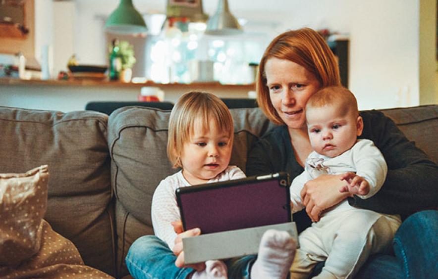 Mom with two kids on tablet