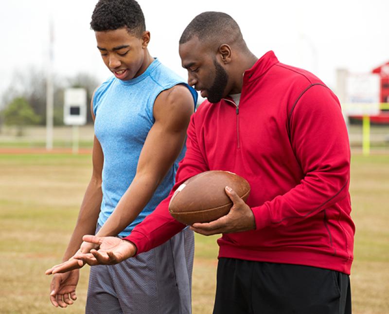 A football player and a coach