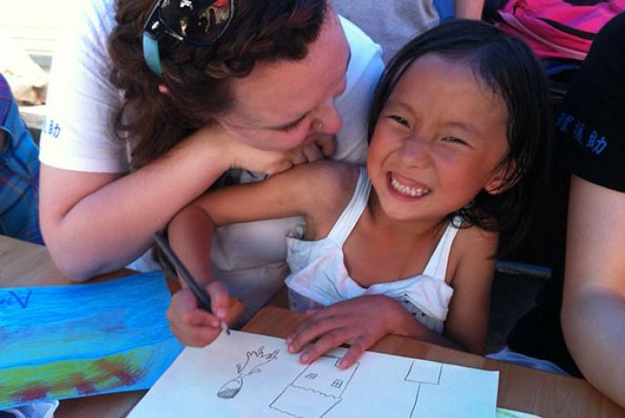Little girl with student